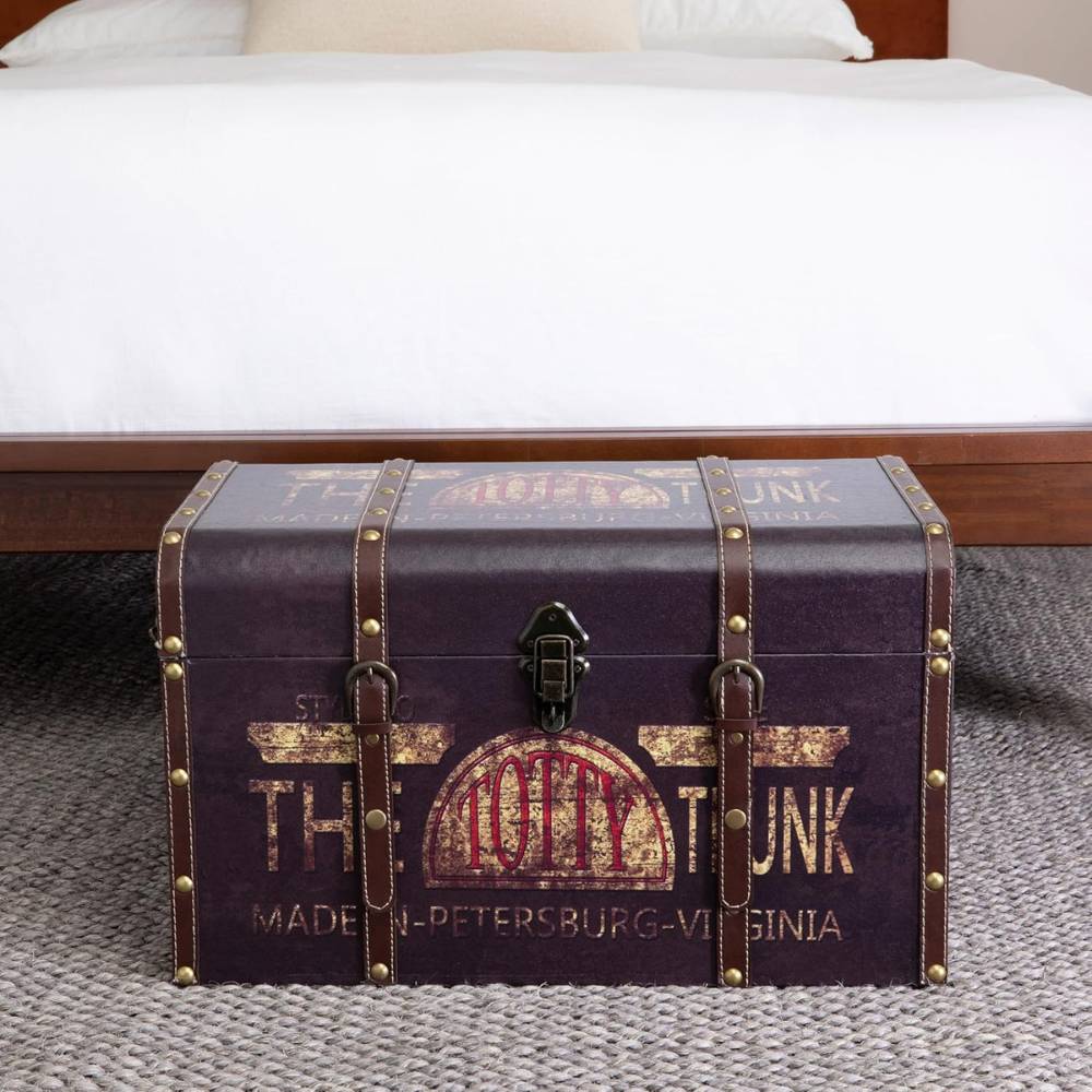 Vintage storage trunk with leather straps and metal rivets